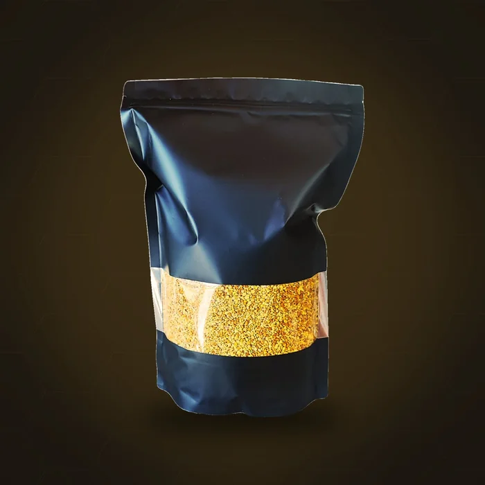 Bolsa de 1 kg de polen de abeja fresco multifloral ApiMan, con ventana que muestra el grano